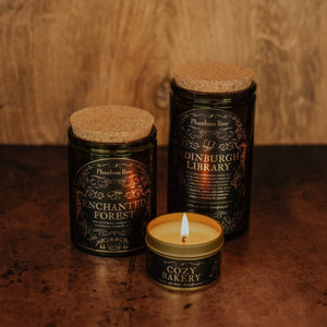 Side by side shot of the three sizes of Phantom Row soy candles – 15 oz jar, 11 oz jar, and 3.3 oz gold tin.
