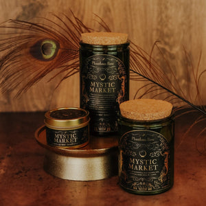 Side by side shot of the three sizes of Mystic Market soy candles – 15 oz jar, 11 oz jar, and 3.3 oz gold tin.
